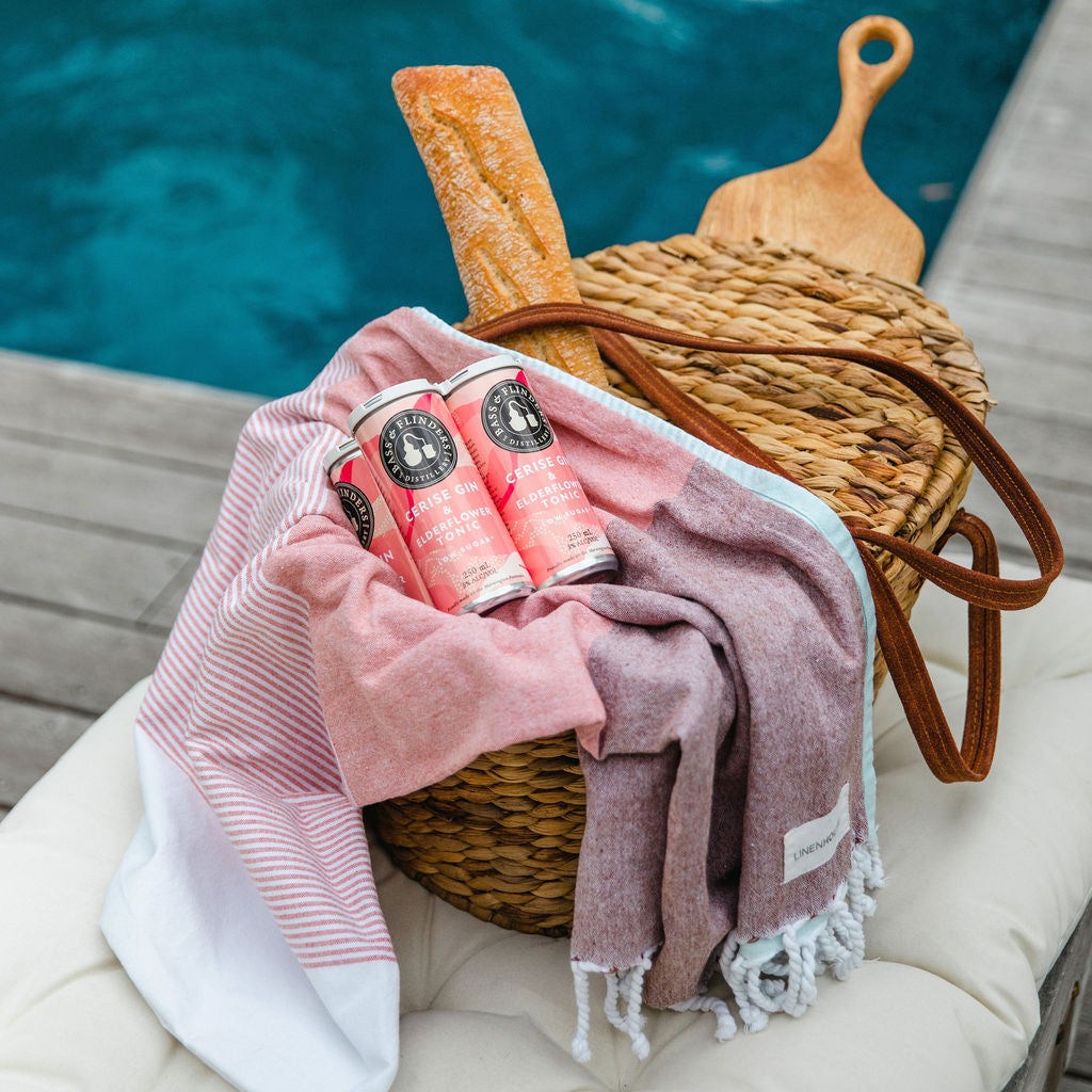 Bass & Flinders Distillery Cerise Gin and Elderflower tonic premixed G&T can in picnic basket by the pool